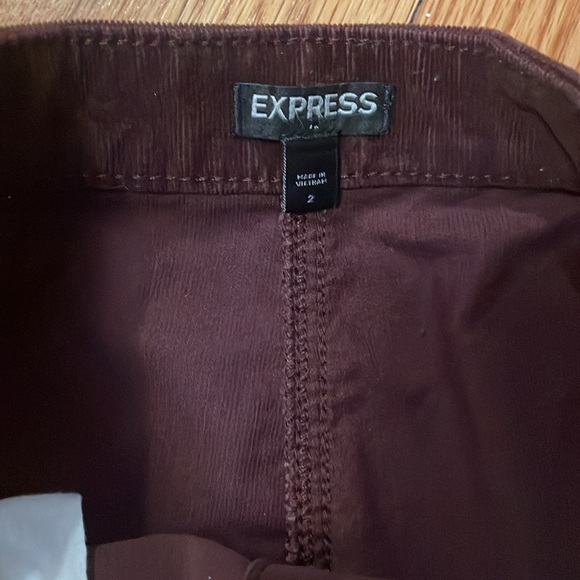 Express corduroy mini skirt. Burgundy. Fun metal grey buttons. Has pockets! - Picture 3 of 4